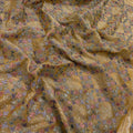Close-up of patterned fabric with floral and geometric designs.