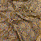 Close-up of patterned fabric with floral and geometric designs.