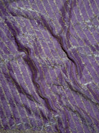 Close-up of purple fabric with gold thread