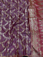 Purple fabric with intricate gold and red patterns